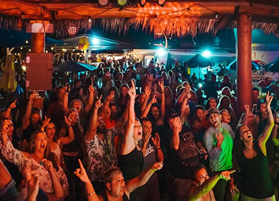 people attending concert in tiki bar