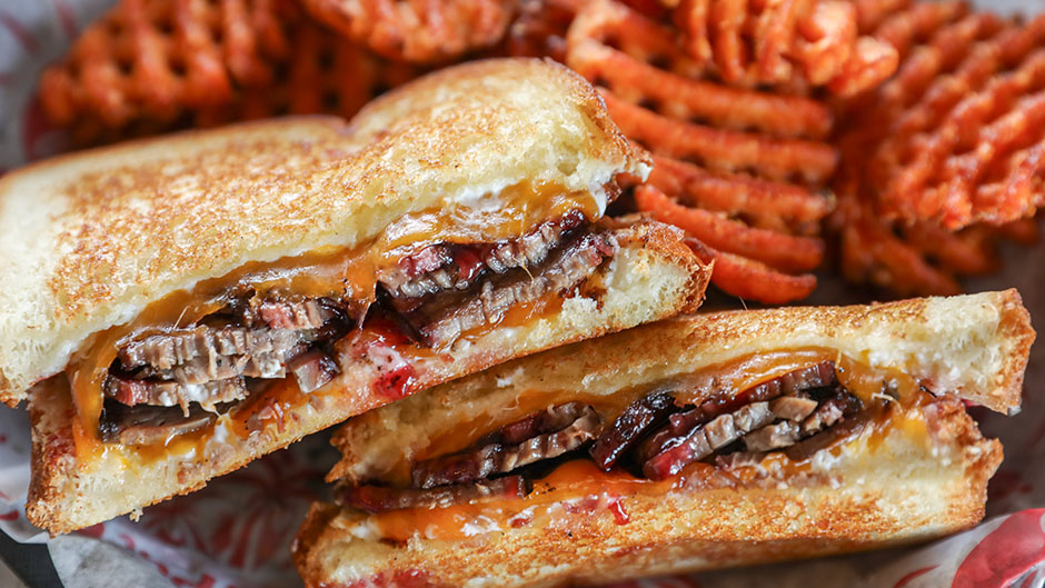 Smoked beef brisket, homemade raspberry sauce, cream cheese & cheddar cheese. Melted together between Texas toast.